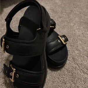 Stylish Black Sandals with Gold Buckles